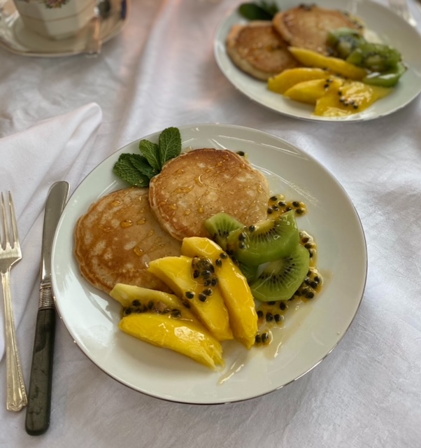 Coconut pancakes with mango kiwi and passion fruit